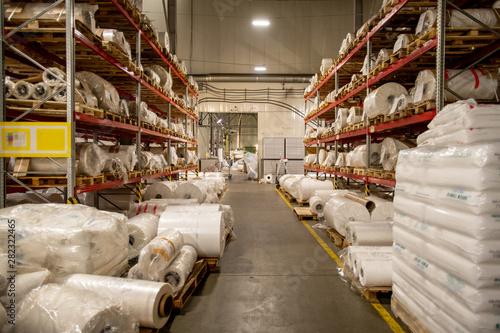 Warehouse of modern chemical production factory with rolled polyethylene film photo