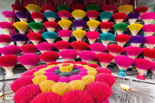 Bundle of traditional colorful Vietnamese incense sticks in a village workshop close to Hue city, Vietnam