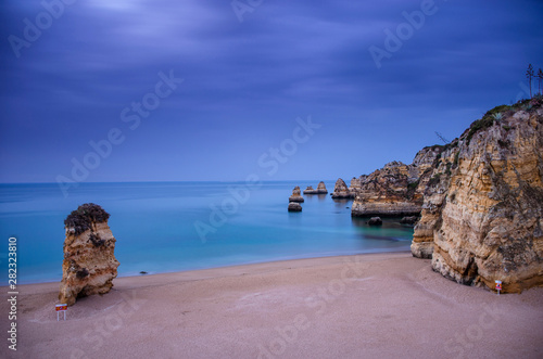 Color, cliffs, seashell hunting, caves, arches and wonderful views at Dona Ana Beach (Praia de Dona Ana), in Lagos, Western Algarve coast, Portugal.
