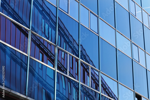 Modern business building windows. Blue Glass Facade with Geometric Lines  Reflection