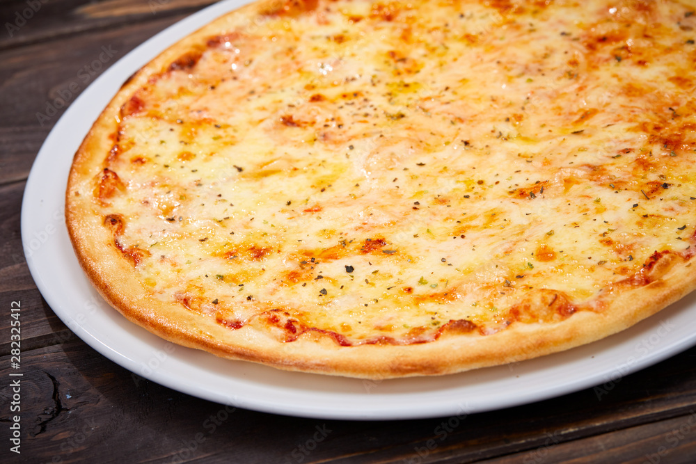 pizza on the wooden background pizza on the wooden background