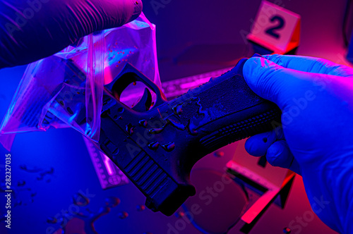 Foto Forensic science, murder weapon and criminal investigation concept theme with de