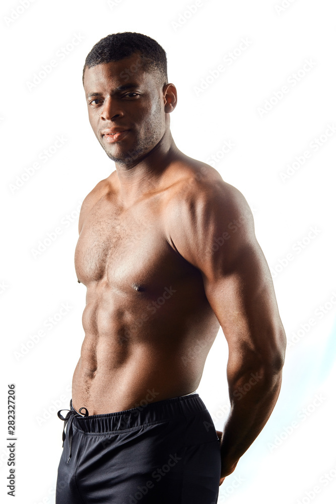 attractive awesome athlete keeping hands behind her back, demonstrating his body isolated over white background. health and body care attractive awesome athlete keeping hands behind her back, demonstrating his body isolated over white background. health and body care