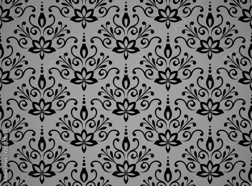 Wallpaper in the style of Baroque. Seamless vector background. Black and grey floral ornament. Graphic pattern for fabric, wallpaper, packaging. Ornate Damask flower ornament