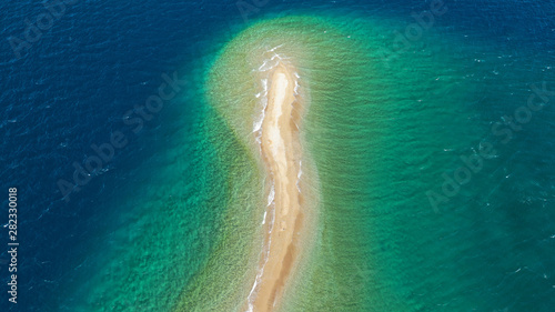 Fototapeta Naklejka Na Ścianę i Meble -  Aerial drone photo of tropical exotic island sand bar separating sea in two with turquoise and sapphire breathtaking colours