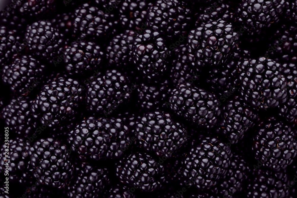 Tasty ripe fresh blackberries with as background, closeup view Tasty ripe fresh blackberries with as background, closeup view