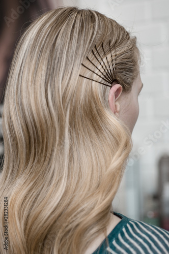 Blonde girl with long hair with wave hairstyle