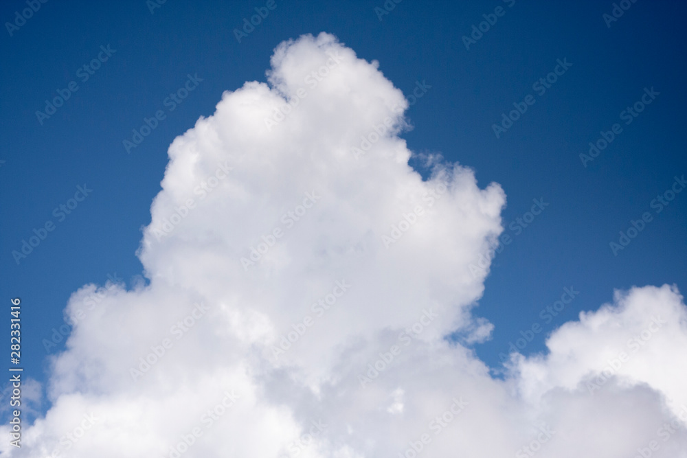 Obraz premium Thick white cloud on blue sky background.
