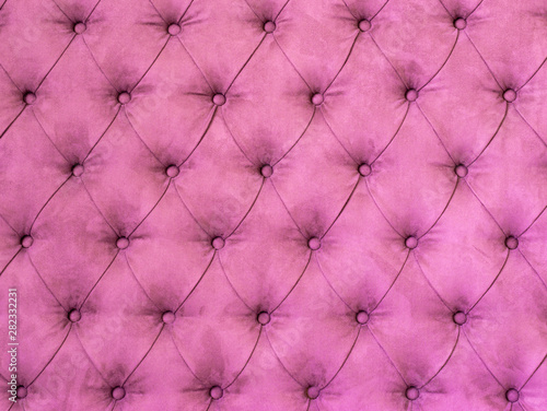 Background with pink upholstered old-fashioned furniture textile.