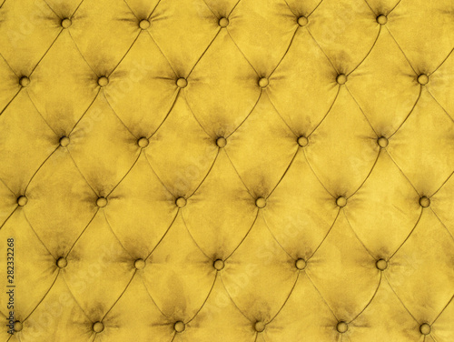 Texture background of upholstered furniture. Yellow colors.