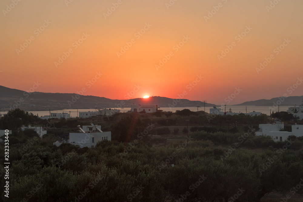 Sun rise in Pollonia village Milos