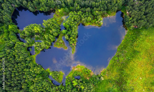 Fototapeta Naklejka Na Ścianę i Meble -  group of lakes among the forest, bright green and blue water, view from drone