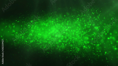 Green shiny glowing glitter background. Dust, particles green colored on dark background. Christmas, festive, greeting pattern. © Ser