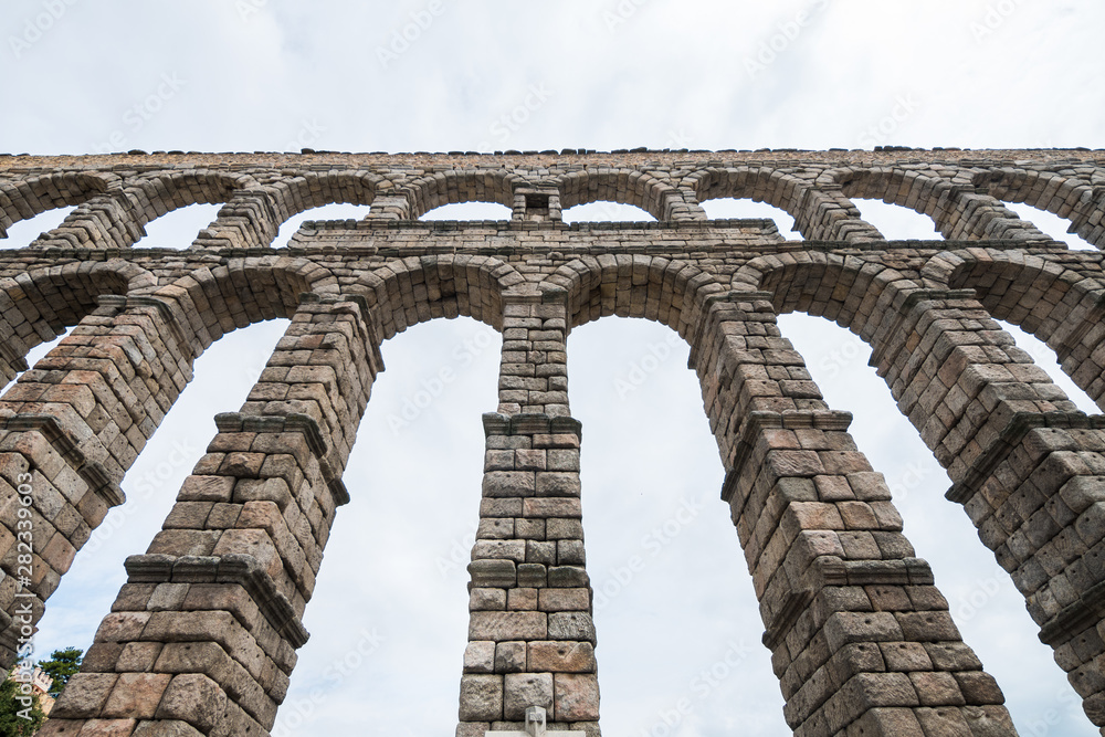 views of roman aqueduct in segovia, spain