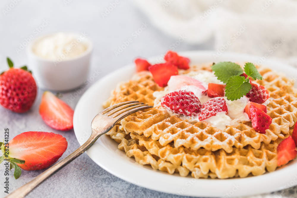 Waffles with strawberries and cream Waffles with strawberries and cream