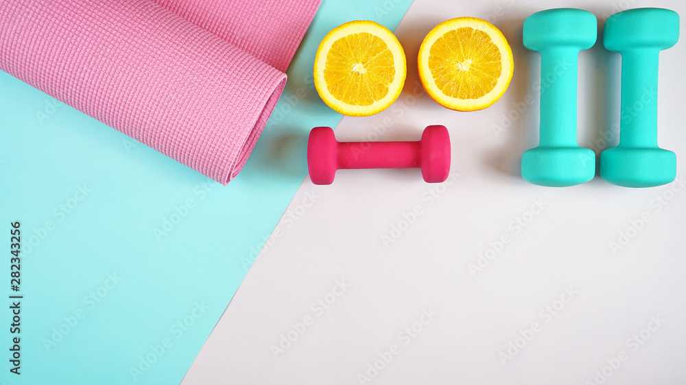 Health and fitness concept flatlay with exercise equipment on modern  colorful background with copy space. Stock Photo