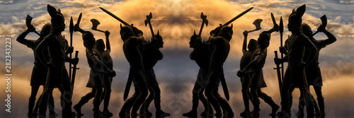 Two identical groups of well armed attacking Vikings (toy vintage soldiers silhouettes), battle scene, sky with thunder clouds, Old Norse mythology, Odin, Valhalla and Asgard theme