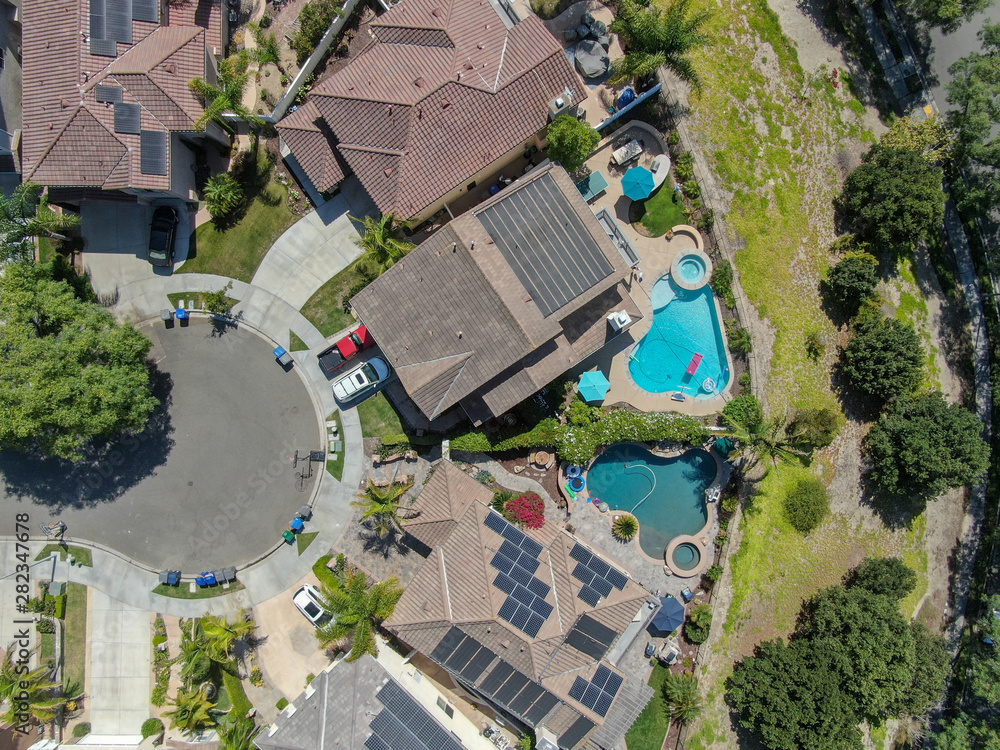 Aerial view suburban neighborhood with big villas next to each other in