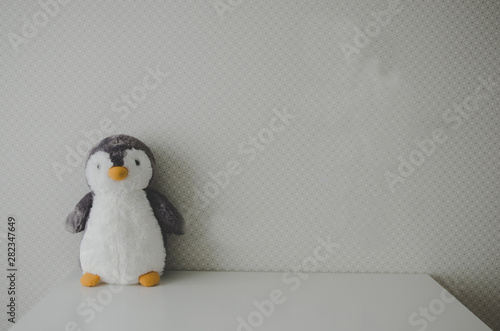 baby nursery with penguin toy