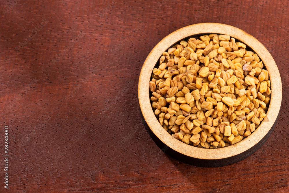 Fenugreek seeds. Trigonella foenum-graecum. Text space Fenugreek seeds. Trigonella foenum-graecum. Text space