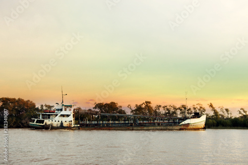 Sand extractor Ship sailing on the Parana River at Sunset 