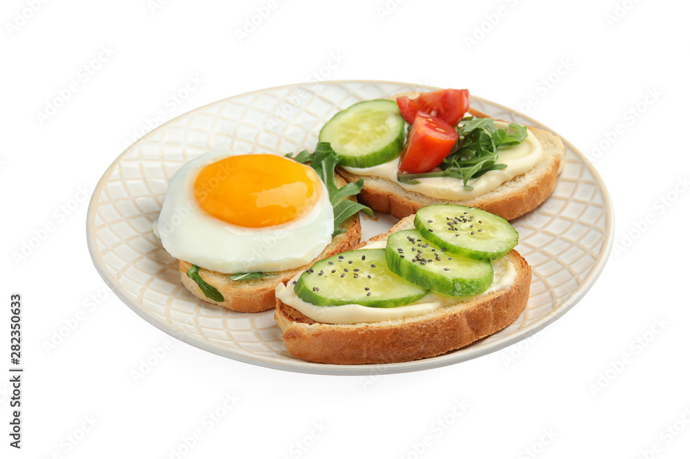 Slices of bread with different toppings on white background