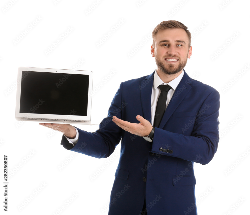 Happy young businessman holding laptop with empty screen on white background, space for text Happy young businessman holding laptop with empty screen on white background, space for text