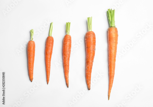 Ripe carrots isolated on white, top view