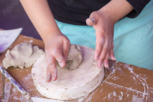 Hands holding Play Dough as Concept of education and therapy photo