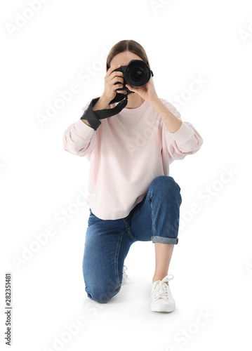 Professional photographer taking picture on white background