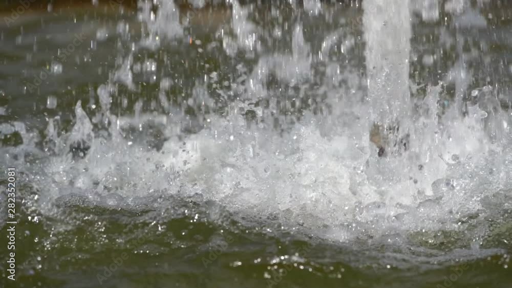 The bottom of a water fountain in slow motion The bottom of a water fountain in slow motion