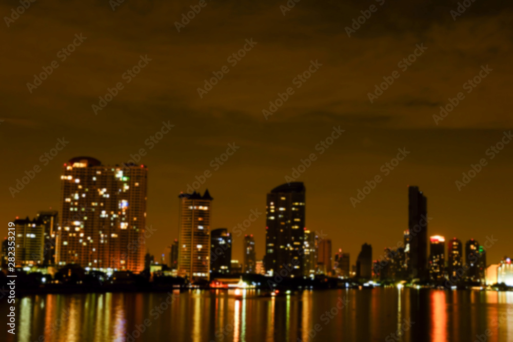 Fototapeta premium light bokeh city landscape at night sky with many stars, blurred background concept.