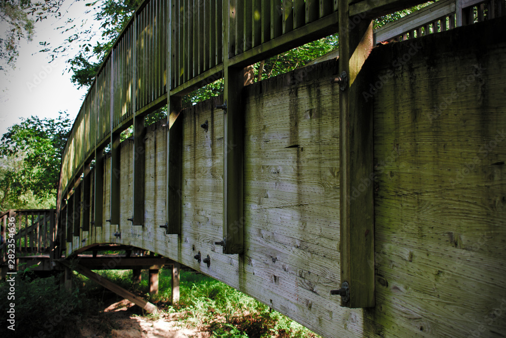 old wooden bridge above stream old wooden bridge above stream