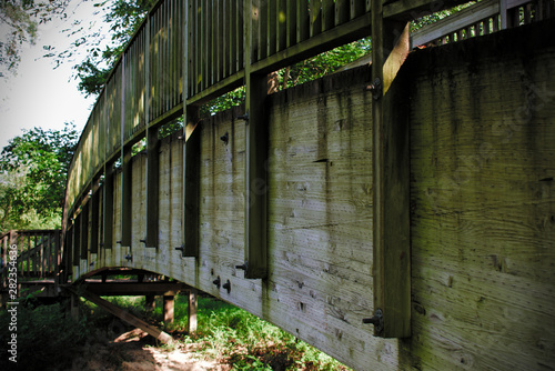 old wooden bridge above stream
