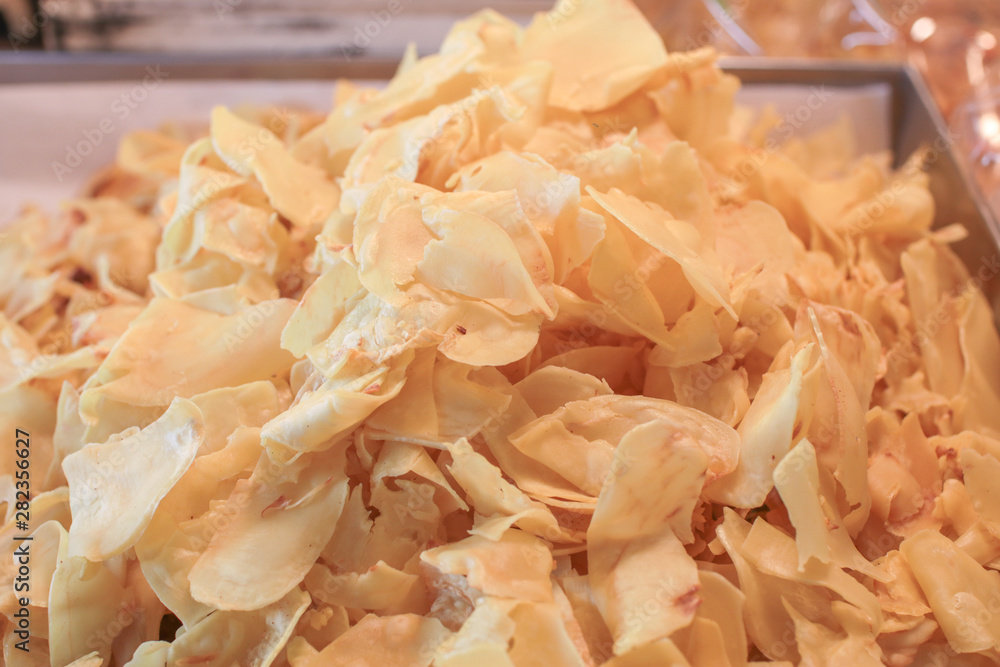 Heap of fried Durian chips is sold in local Thai market. Traditional crispy Thai dessert dry Durian. Heap of fried Durian chips is sold in local Thai market. Traditional crispy Thai dessert dry Durian.