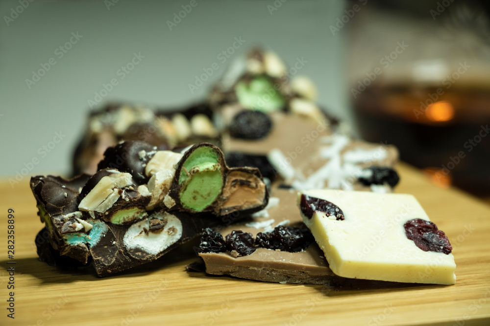 pieces of handmade black and white chocolate stuffed with coconut, raisins and marzipan pieces of handmade black and white chocolate stuffed with coconut, raisins and marzipan