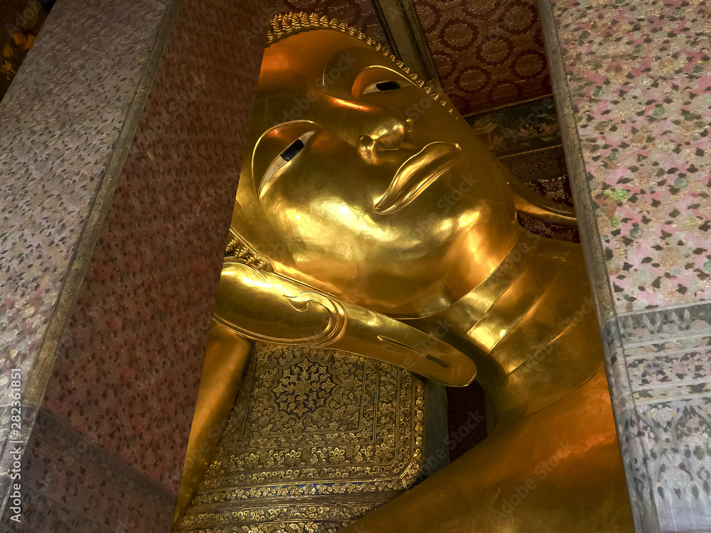 close shot of the reclining buddha at wat pho temple in bangkok