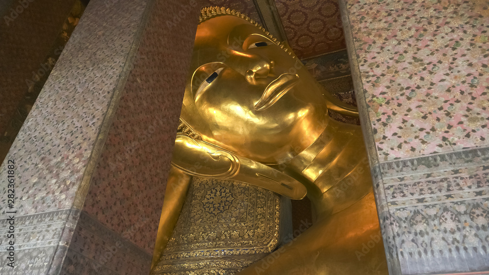 wide shot of the reclining buddha at wat pho temple in bangkok