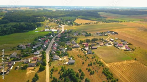 Flight over small village in Poland. 4k aerial footage.