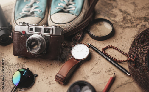 Travel Concept Background. Traveler's Accessories on Old Vintage Map