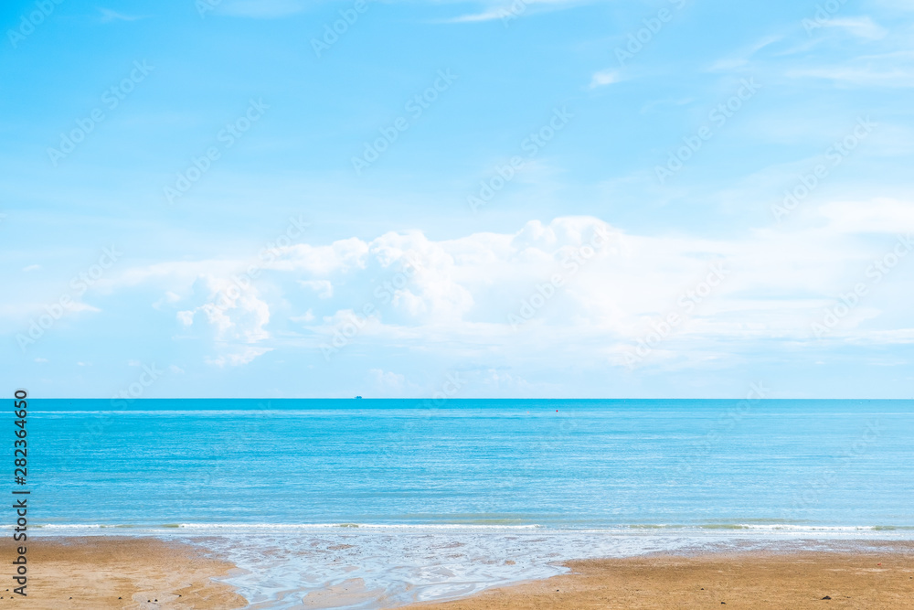 beautiful beach of tropical sea with blue sky and sand for background