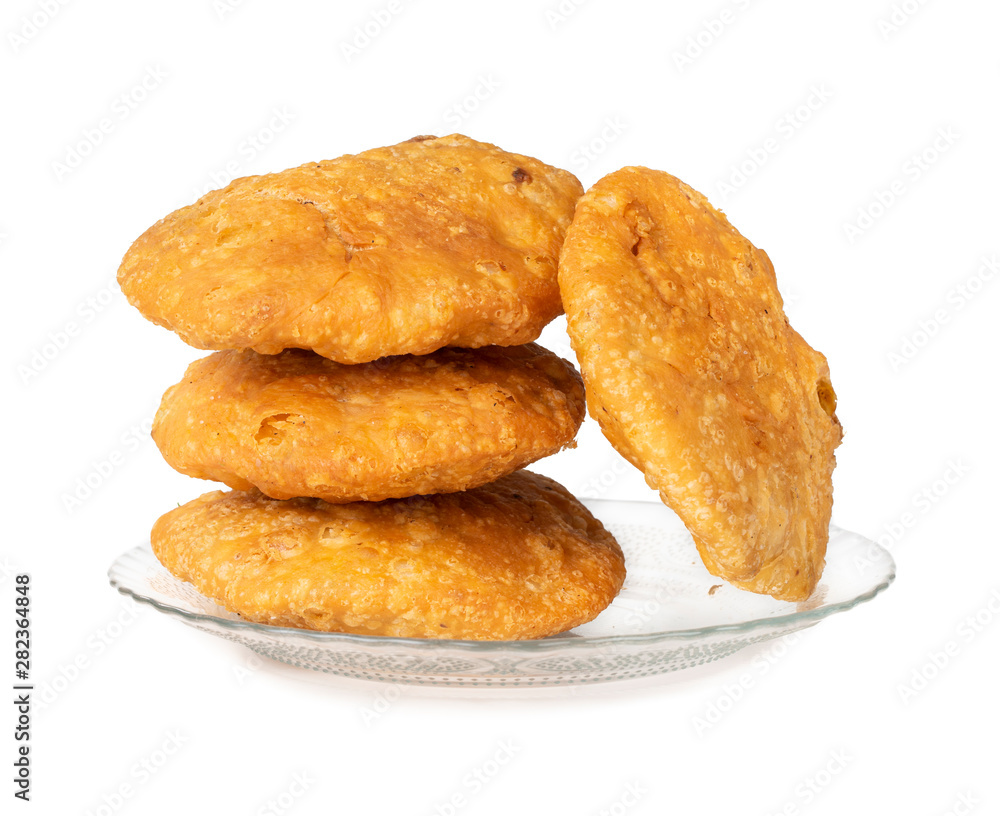 Indian Popular Spicy Snack Kachori Also Know as Kachodi, Katchuri And Fried Dumpling on White Background Indian Popular Spicy Snack Kachori Also Know as Kachodi, Katchuri And Fried Dumpling on White Background