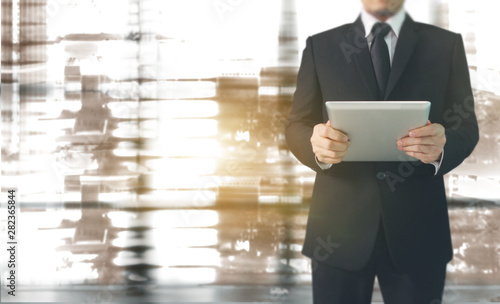 Businessman using digital tablet in hand