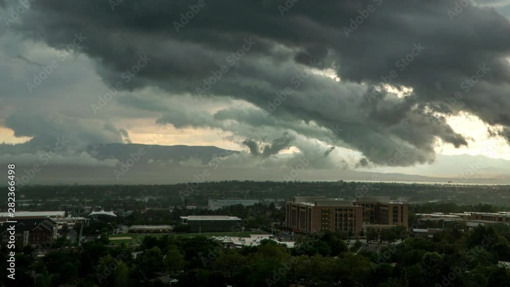 Time lapse of dark clouds moving fast over city kicking dirt into the air overlooking Provo, Utah. Time lapse of dark clouds moving fast over city kicking dirt into the air overlooking Provo, Utah.