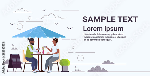 obese couple sitting at table eating sweet tasty cake overweight african american man woman spending time together unhealthy nutrition obesity concept flat full length horizontal copy space