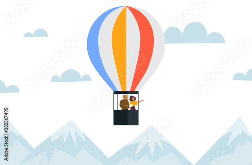 couple flying in basket of hot air balloon african american man using tablet woman pointing hand at something romantic date concept mountains landscape background horizontal flat