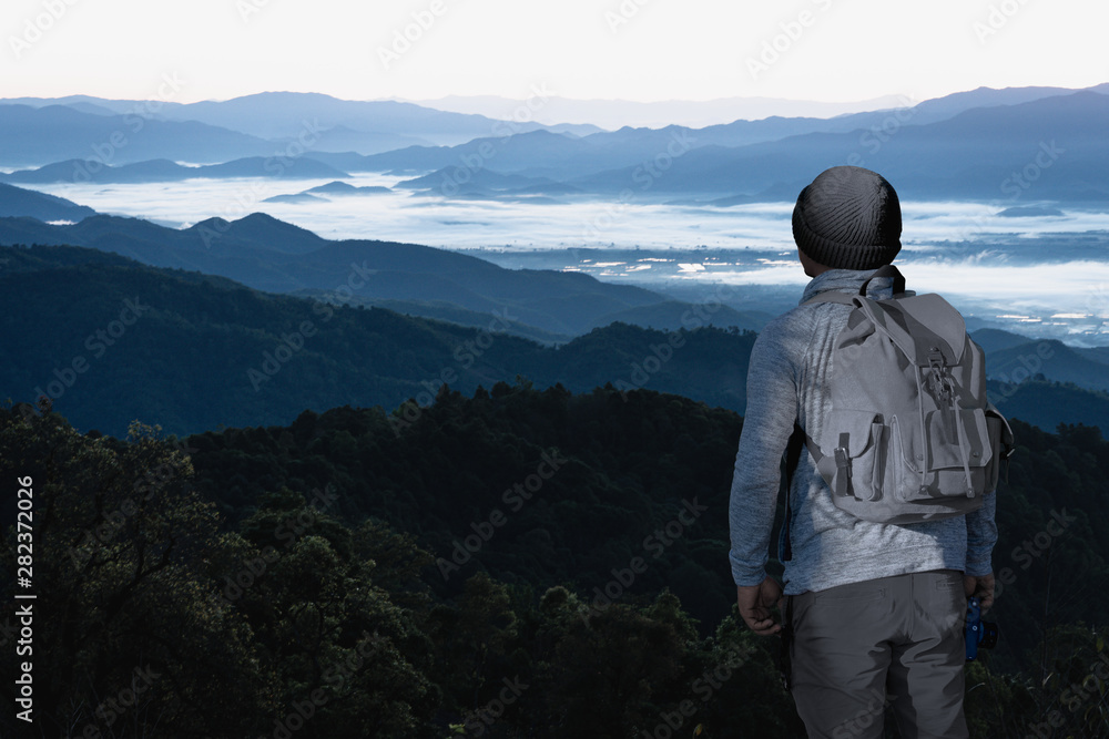 Man photographer holding the camera with landscape mountains and sky natural background. Man photographer holding the camera with landscape mountains and sky natural background.
