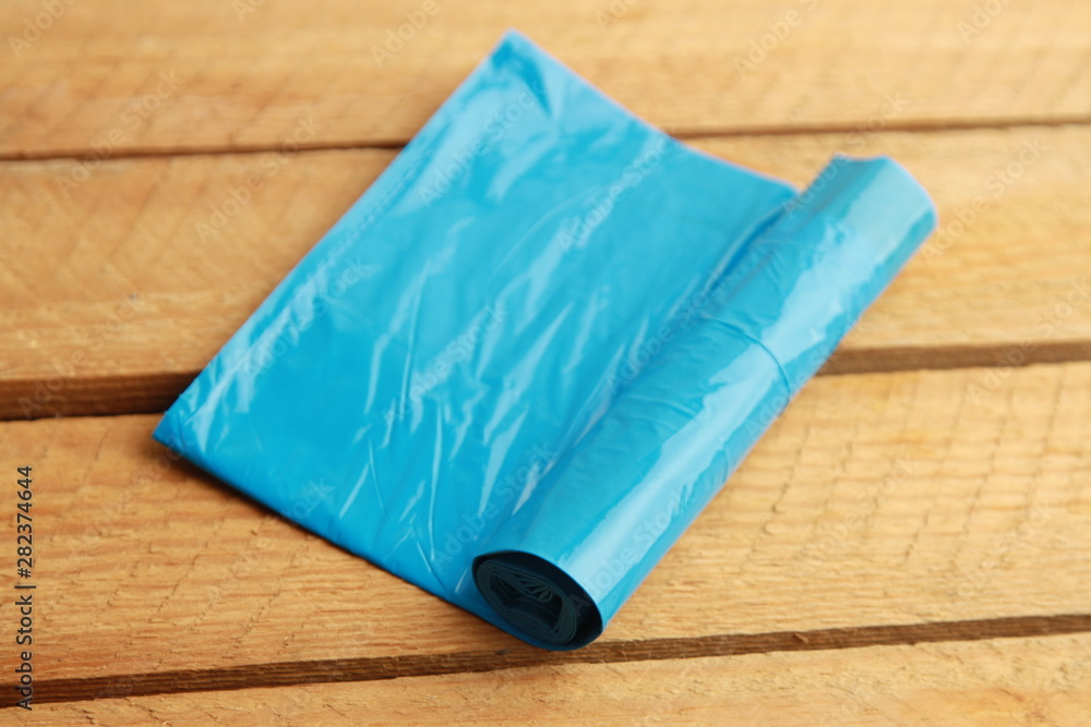 roll of blue garbage bags
