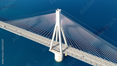 Fototapeta Naklejka Na Ścianę i Meble -  Aerial drone photo of modern cable anti seismic bridge crossing deep blue sea