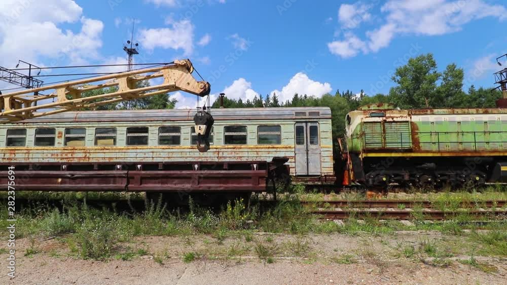 Rusty Train Wagons And Crane on Abandoned Railway in Chernobyl Nuclear Alienation Zone Rusty Train Wagons And Crane on Abandoned Railway in Chernobyl Nuclear Alienation Zone